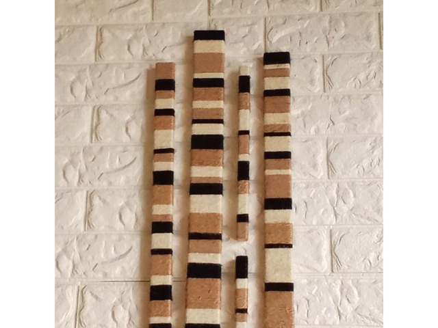 Настінний декор у стилі лофт з дерев’яних планок та джутового шпагату